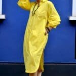 Model in Yellow Relaxed buttoned down dress posing front