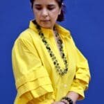 Model in Yellow Relaxed buttoned down dress - close up