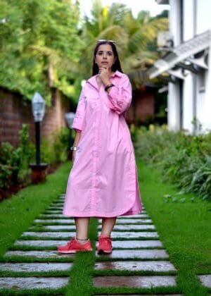 Model in Pink Relaxed buttoned down dress posing front