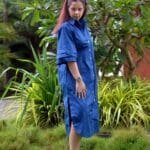 Model in Navy Relaxed buttoned down dress posing side
