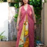 Model in Printed Halter Flare Dress posing front