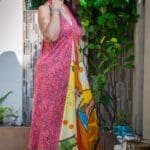 Model in Printed Halter Flare Dress posing side