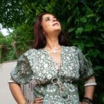 Model in Smocking Puff Sleeve Blouse posing while looking up