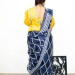 Model in Smocking Puff Sleeve Blouse posing back