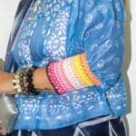 Model in Smocking Puff Sleeve Blouse posing side