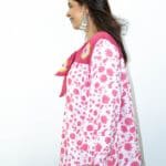 Model in Pink Bow-tie Printed Dress posing side