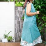 Model in Turq Mix Printed Layered Dress posing side