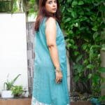 Model in Turq Mix Printed Layered Dress posing back