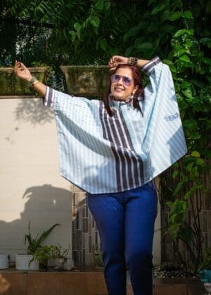 Model in Blue Boxy Pleated Top posing front
