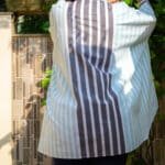 Model in Blue Bozy Pleated Top posing back