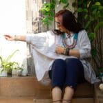 Model in Grey Boxy Pleated Top posing front