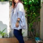 Model in Grey Boxy Pleated Top posing side