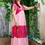 Model in Red Shoulder Bow Tiered Maxi Dress posing side