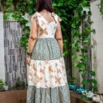 Model in Green Shoulder Bow Tiered Maxi Dress posing back