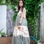 Model in Green Shoulder Bow Tiered Maxi Dress posing side