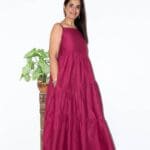 Model in Burgundy Low-back tiered Dress posing side