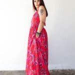 Model in Red Printed Backless Halter Dress posing side