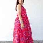 Model in Red Printed Backless Halter Dress posing side