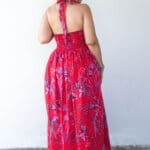 Model in Red Printed Backless Halter Dress posing back